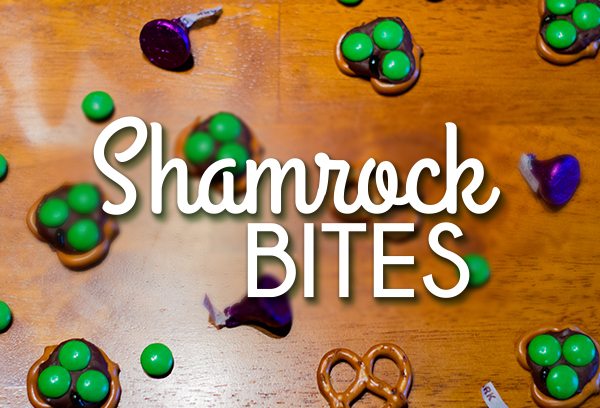 Shamrock Bites: pretzels with chocolate and green candy on table