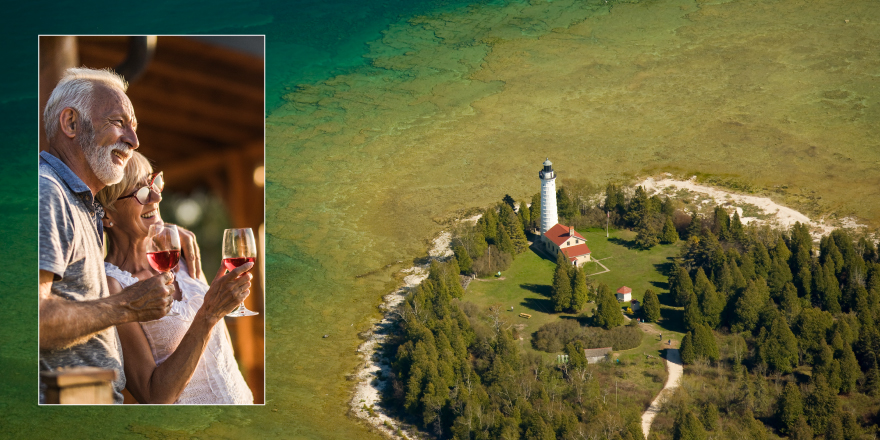 Couple enjoying glass of wine and seascape with lighthouse 