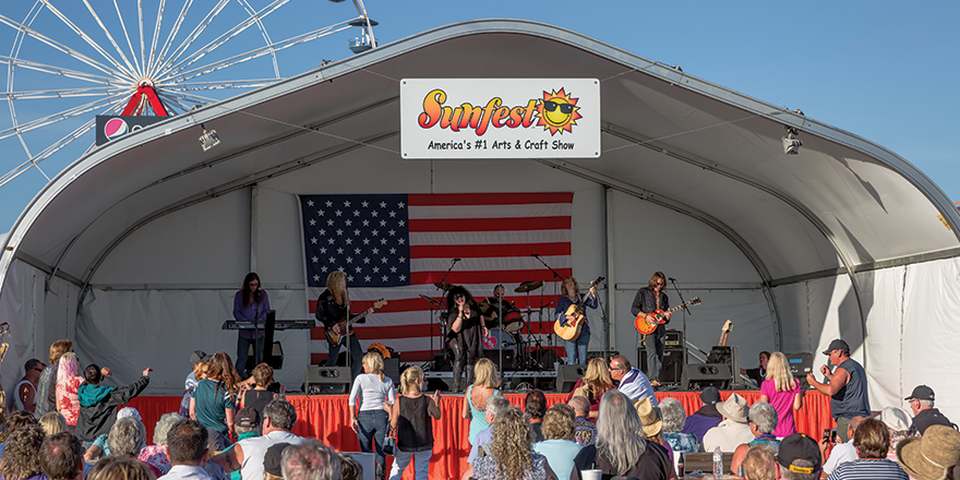 Sunfest amphitheater with band and crowd