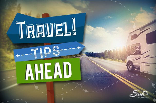 Travel Tips ahead road sign next to RV