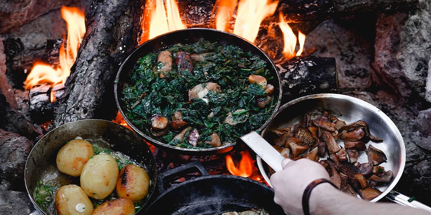 Cast iron skillet over campfire grill