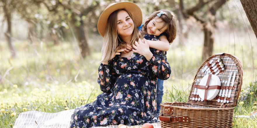 Mother with child on picnic in park