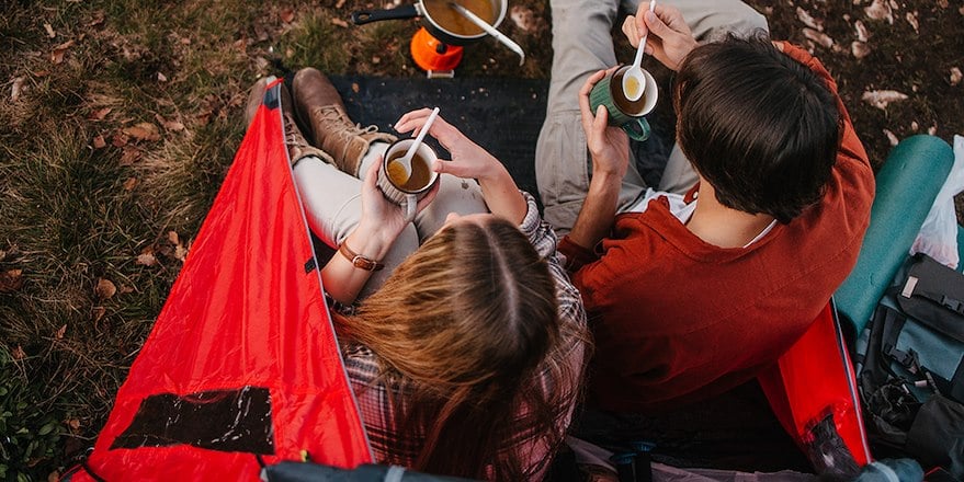 Adults enjoying a cup of soup