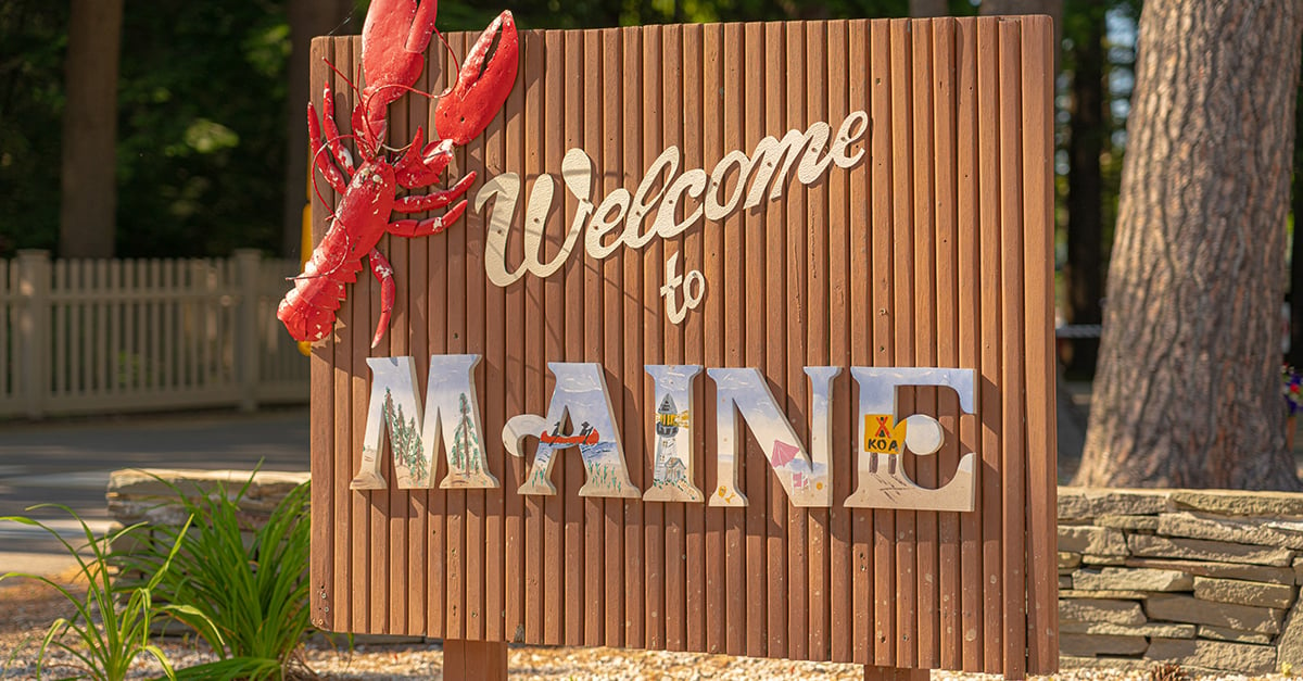 Welcome to Maine sign with lobster