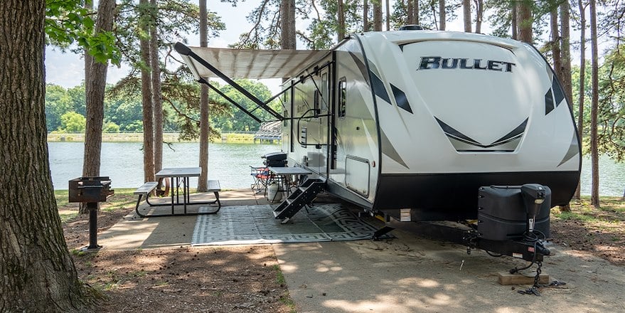 Two RVs at campsites