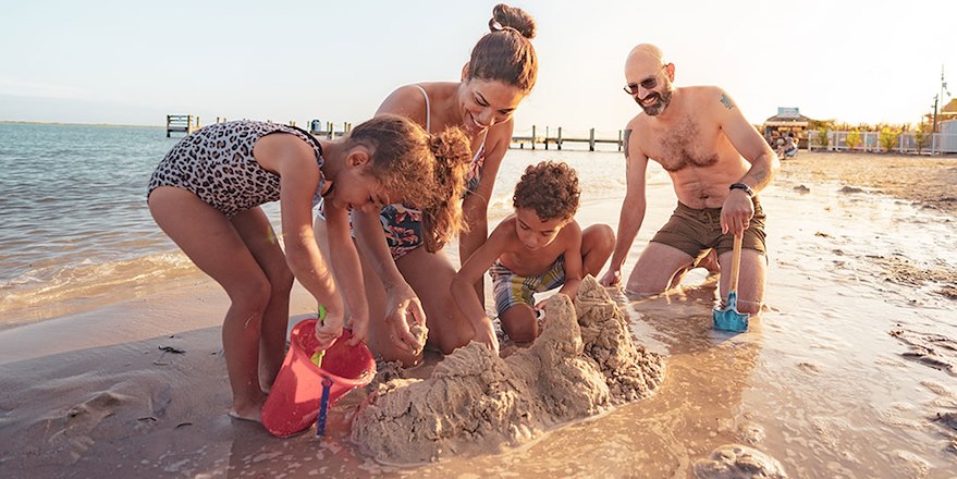 Family playing on beach