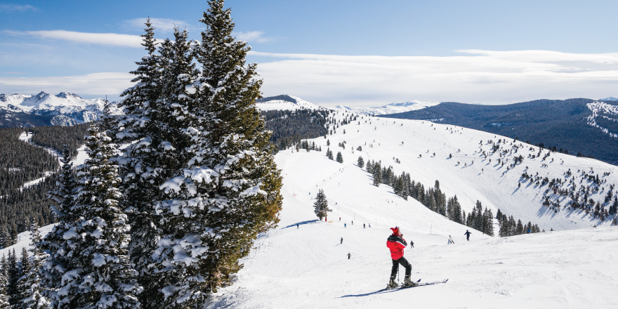 Person skiing on snow-covered mountain